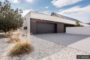 A high-quality image of a sleek, modern anthracite grey smooth-grain door, showcasing its elegant design and premium finish, perfect for contemporary home or business settings.